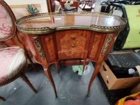 A French walnut bedside table with gilt and marquetry decoration