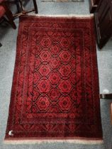 A mostly red and blue rug 1.9m x 1.2m