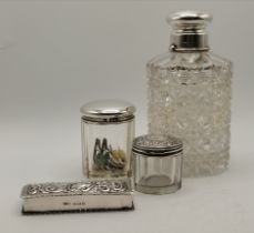 A silver dressing table box and three silver-lidded cut glass jars, Victorian and later