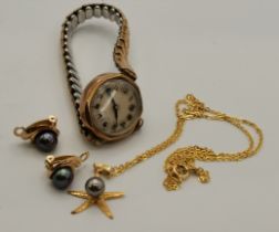 A yellow metal and black pearl necklace and earrings suite, and a lady's wristwatch