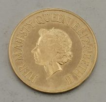 A 9ct gold commemorative coin, 1977