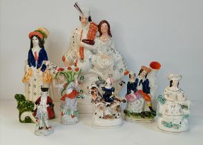 A collection of Staffordshire vase and figurines