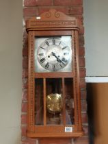Early 20th Century carved Oak Wall clock with pendulum