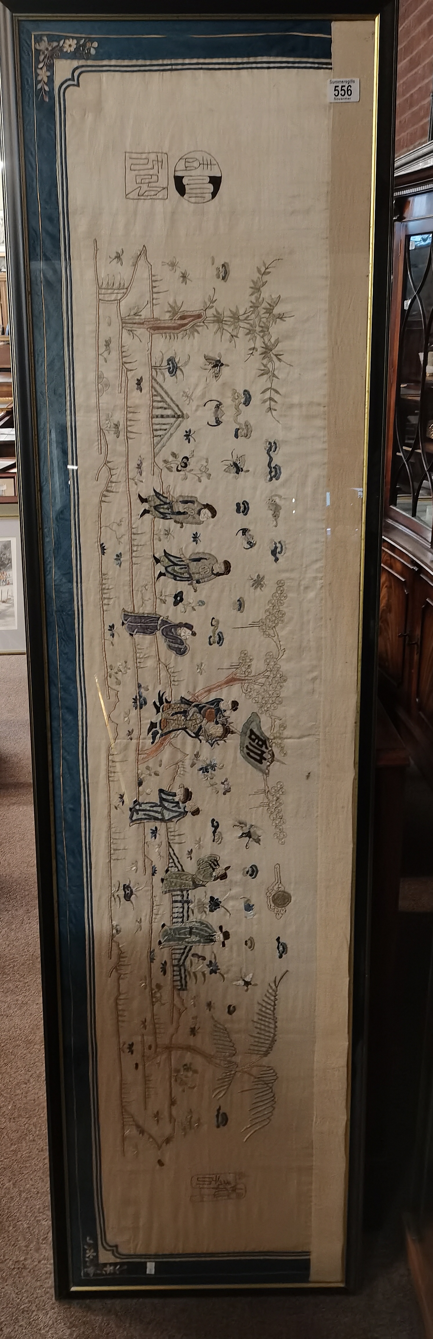 A long Chinese silk embroidered panel, framed