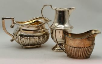Three silver cream jugs, 20th Century