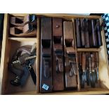 Large box of wood working planes and tools