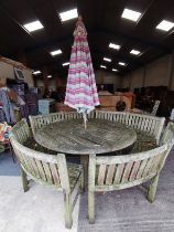 Large Teak Round Garden Table with 4 curved benches and wind up Parasol