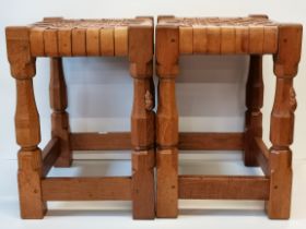 Robert Thompson, a pair of Mouseman oak and leather stools