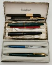 Four fountain pens, three ball point pens, and a propelling pencil