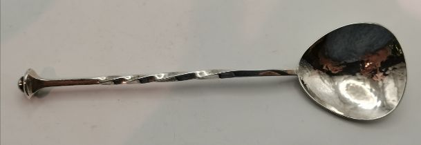 An Arts and Crafts silver spoon