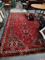 A large 3.3m x 2.3m multicoloured rug