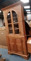 A 6ft high pine standing corner cupboard