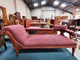 A Victorian mahogany chaise longue with good carving on castors