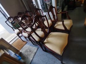 A set of 8 reproduction mahogany dining chairs wit