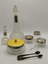 A small group of silver plate and silver-mounted dressing table jars
