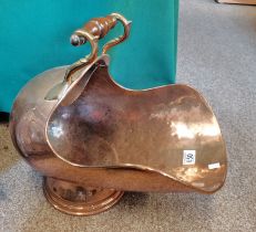 A Victorian copper helmet coal scuttle