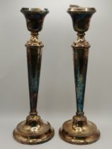 A pair of George V silver candlesticks