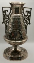 A highly decorated silvered vase 30cm high with so