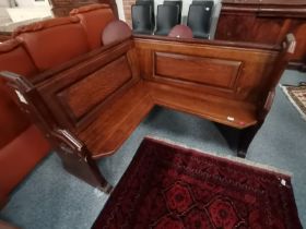 An oak corner church pew