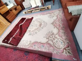 A pink and cream floral rug 3.6m x 2.7m
