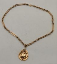 A 9ct gold fob medallion on chain