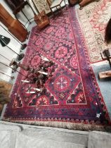 A mostly red and blue large Soumak rug 3.7m x 2.1m