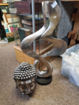 Metal Music Note Sculpture and a Budda Head