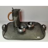 A three-piece Tudric pewter tea service and tray, early 20th Century
