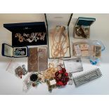 A box of various necklaces, brooches etc