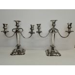 A pair of silver-plated three-light candelabra