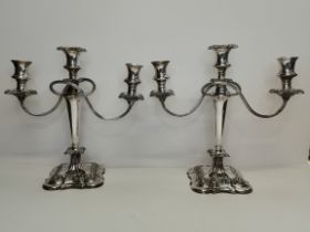 A pair of silver-plated three-light candelabra