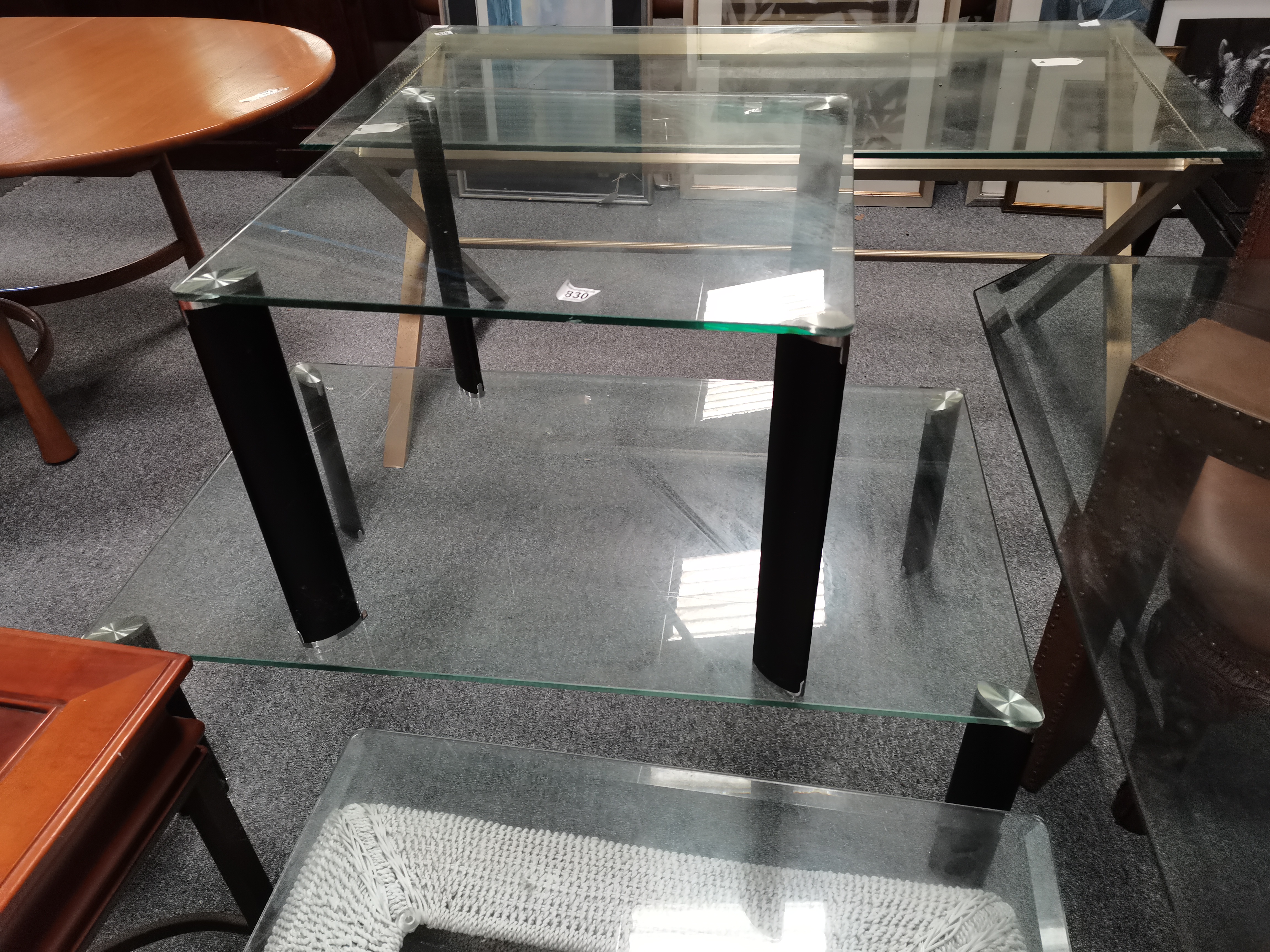 A glass coffee table and matching side/ lamp table