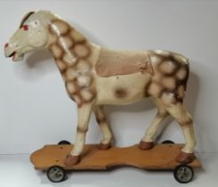 A child's pull-along papier-mâché toy horse, early 20th Century