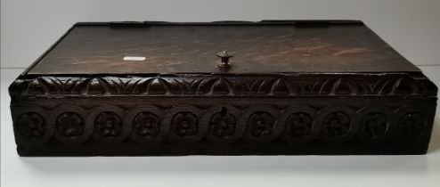 A carved oak bible box