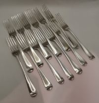 A set of thirteen George III silver table forks