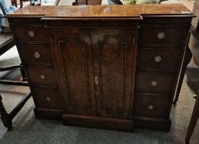 A beautiful birds eye walnut sideboard with8 drawe