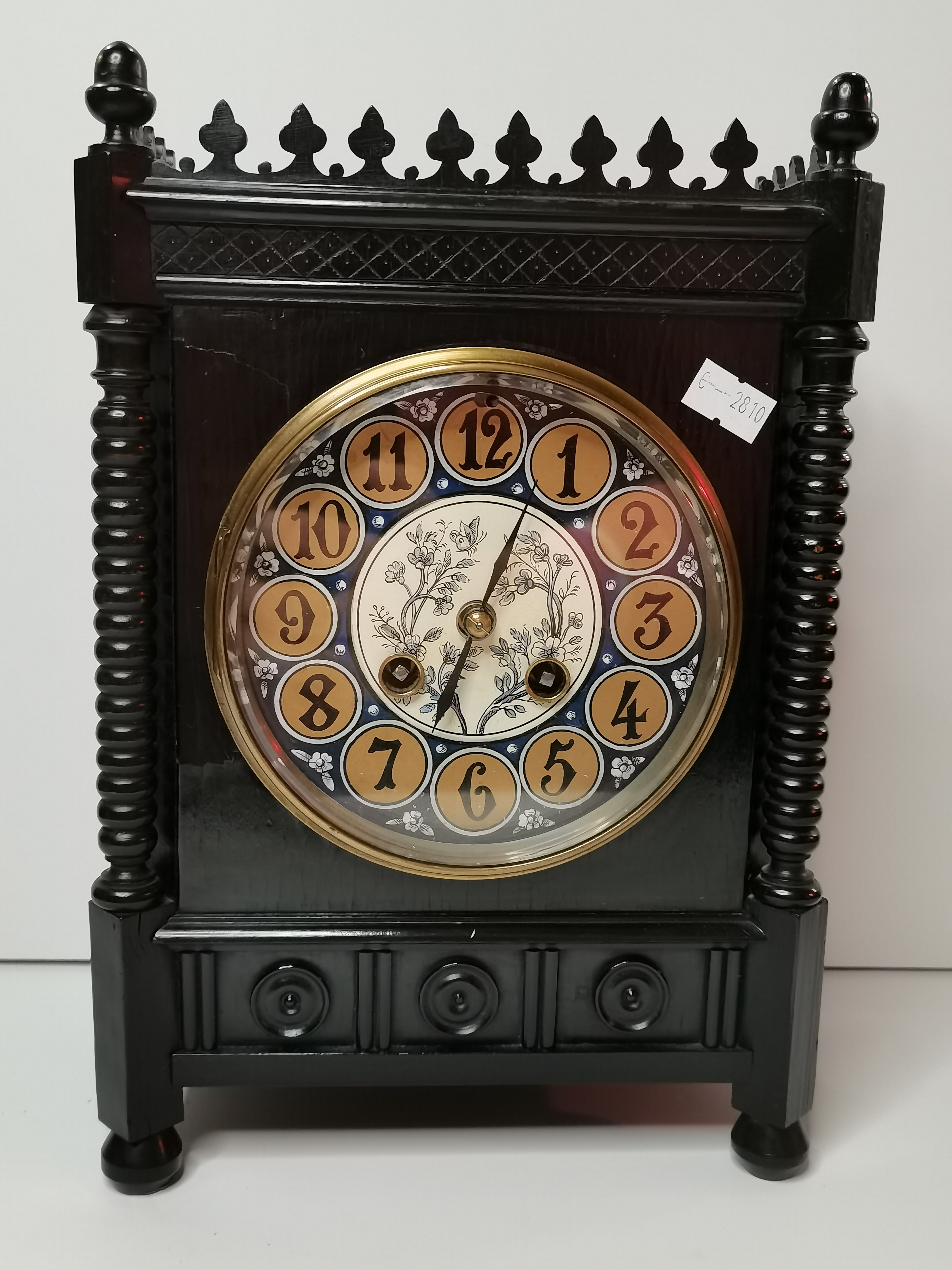 A Victorian Aesthetic Movement ebonised mantel clock