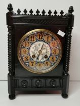 A Victorian Aesthetic Movement ebonised mantel clock