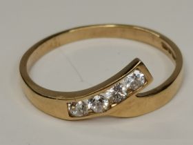 A 9ct gold with diamond cross over style ring size