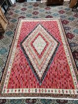 A multicoloured rug 2m x 2m