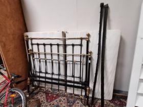 A brass and cast iron bed 1.3m width with base and