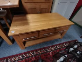 An oak coffee table / storage cupboard