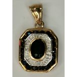 A 9ct gold pendant with diamond and sapphire stone