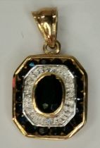 A 9ct gold pendant with diamond and sapphire stone