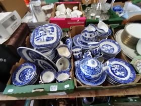 Large collection of blue and white willow pattern crockery