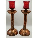 A good pair of Arts and Crafts copper 32cm candlesticks marked NEWLYN