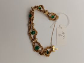 Gold bangle with 6 green stone and 29 pearl decoration 48g