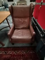 A retro mid century style leather arm chair
