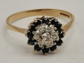 A 9ct gold blue and white stone cluster ring