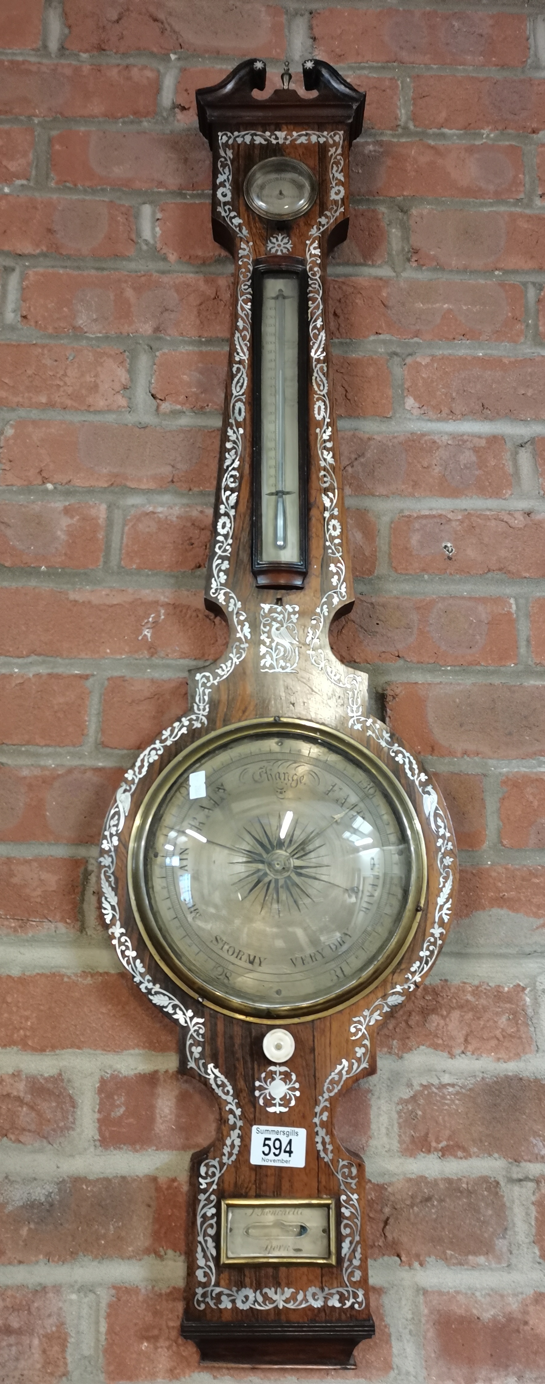 An Antique rosewood and mother of pearl barometer. J~Bonchelli York